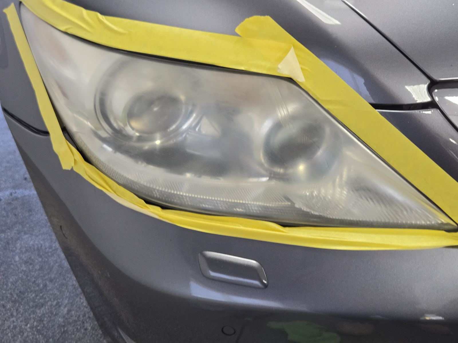 Paint correction in progress showing a clear line between corrected and uncorrected paint