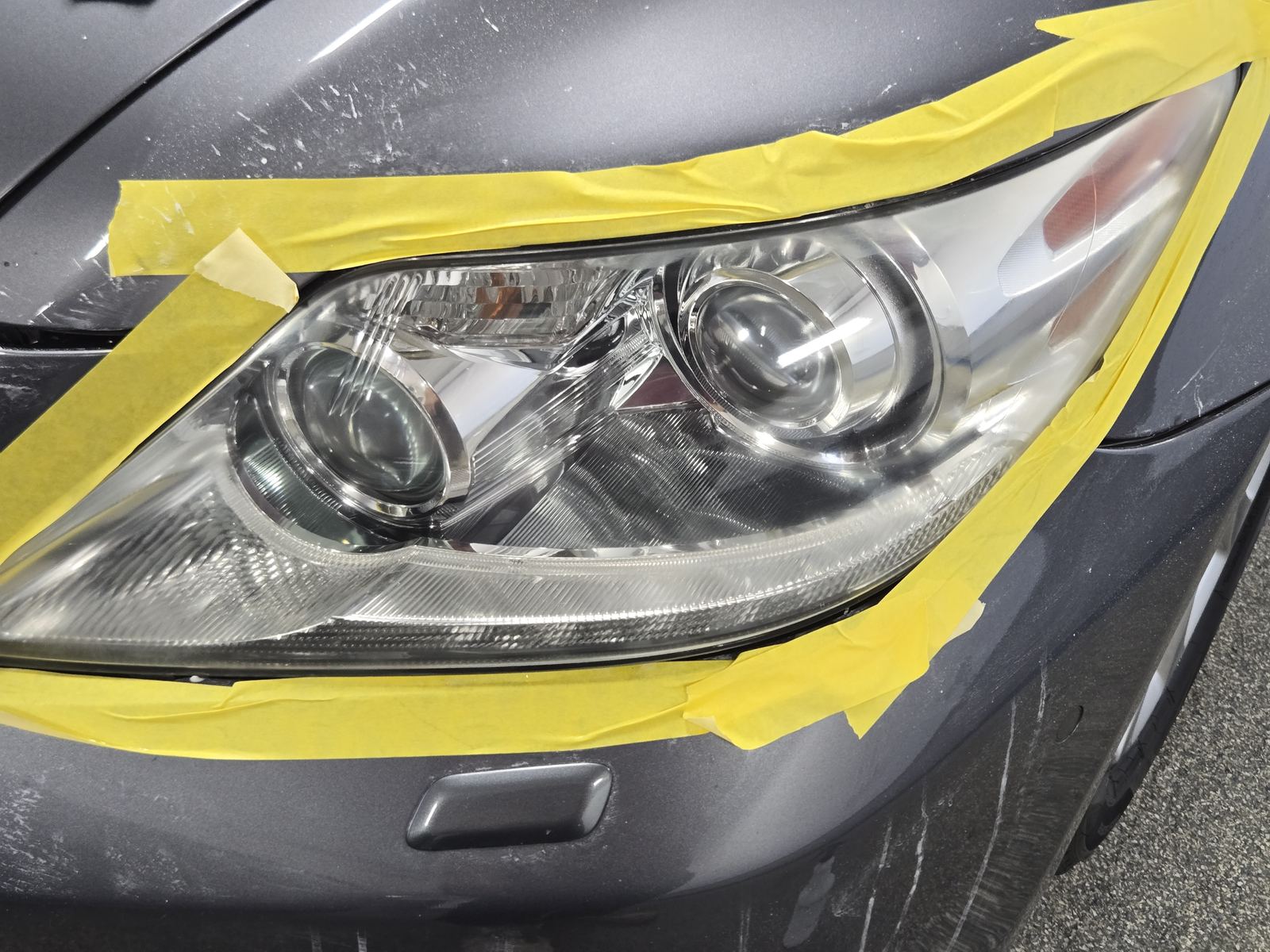 Hazy oxidized headlight before restoration